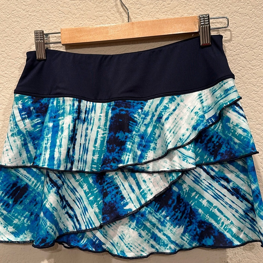 Tennis skirt by Fila. Layered skirt with built in shorts & pockets. Size small
